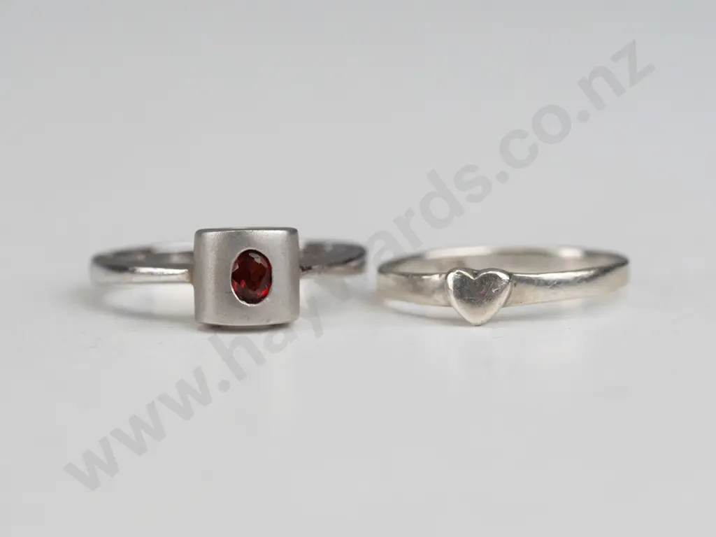 silver ring with small red stone & small silver ring with a heart, both stamped 925 Image 1++