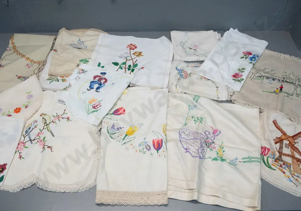 assorted hand-embroidered table linen including table cloths, mats, tray cloths etc. - mostly Dutch and floral motifs Image 1++