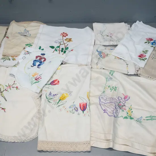 assorted hand-embroidered table linen including table cloths, mats, tray cloths etc. - mostly Dutch and floral motifs