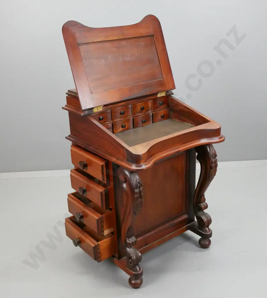 reproduction mahogany Davenport desk with lidded top compartment, leather insert on lift up lid, 8 interior drawers, 4 Image 1++
