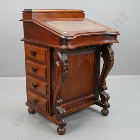 reproduction mahogany Davenport desk with lidded top compartment, leather insert on lift up lid, 8 interior drawers, 4
