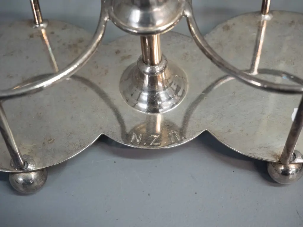 silver plated serving ware with impressed NZR lettering: handled sweet dish and a handled condiment / bottle holder H270 Image 1++