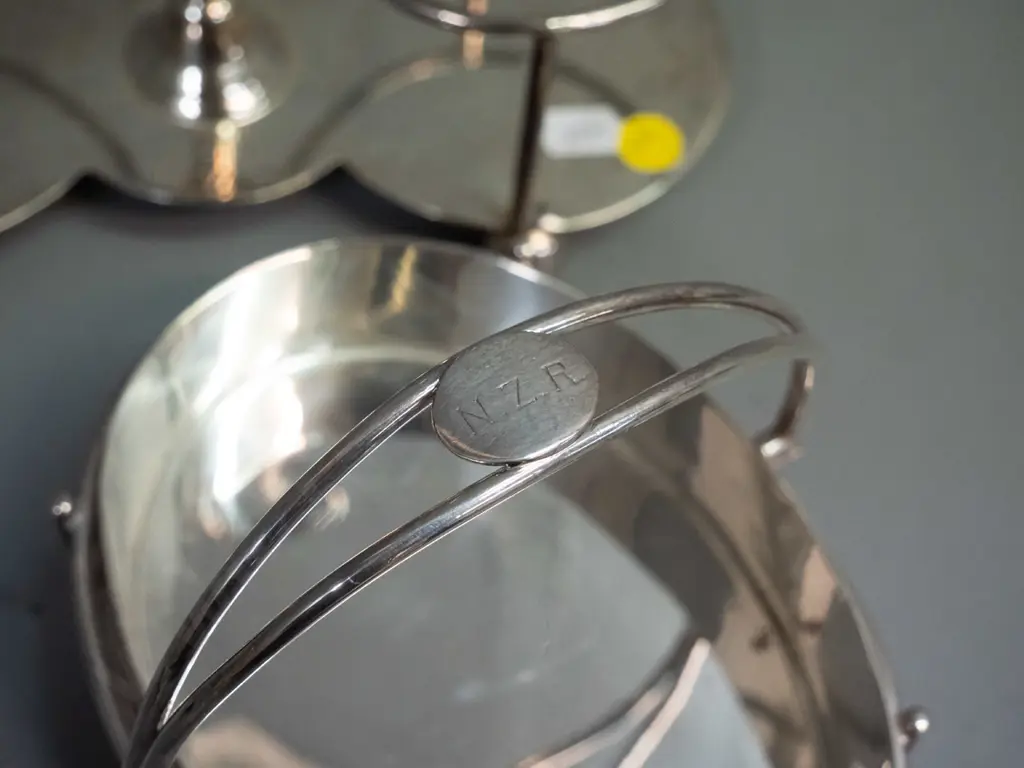 silver plated serving ware with impressed NZR lettering: handled sweet dish and a handled condiment / bottle holder H270 Image 1++