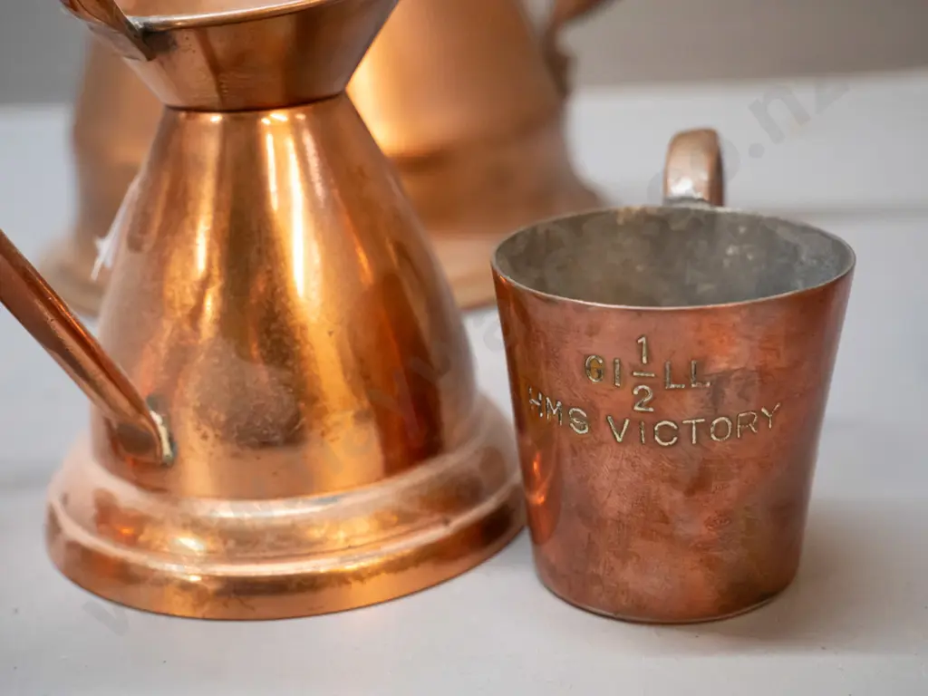 6 copper items: Cobra New Zealand vase with beaten band decoration H-205, graduated set of 4 jugs, large one with dent Image 1++
