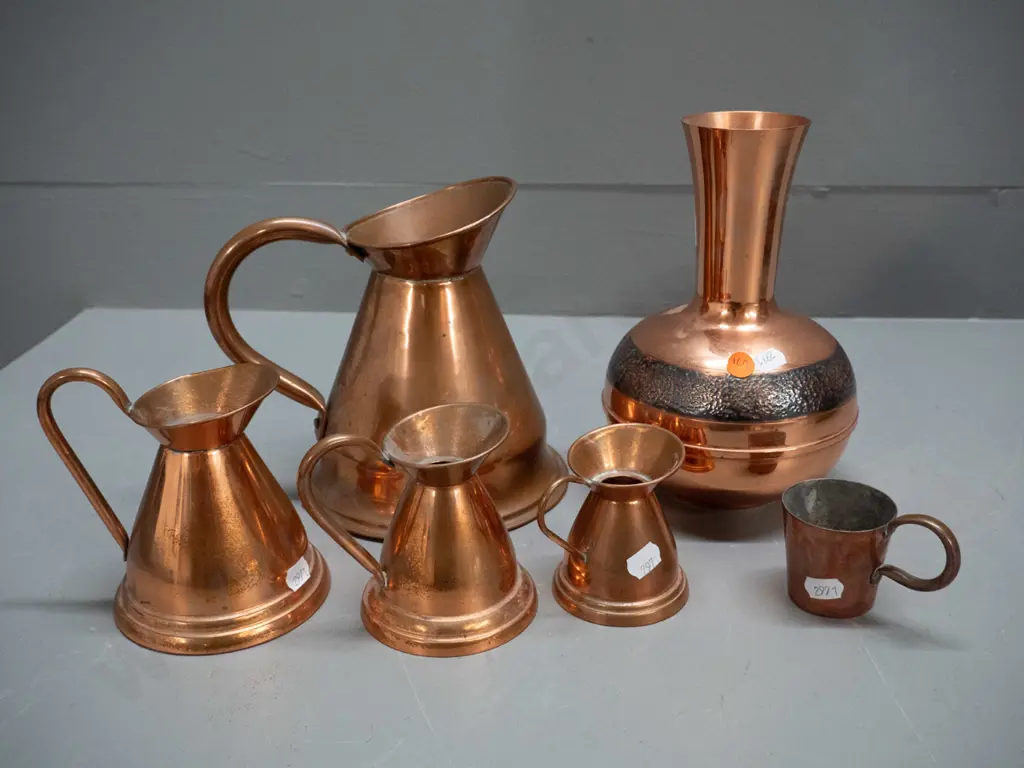 6 copper items: Cobra New Zealand vase with beaten band decoration H-205, graduated set of 4 jugs, large one with dent Image 1++