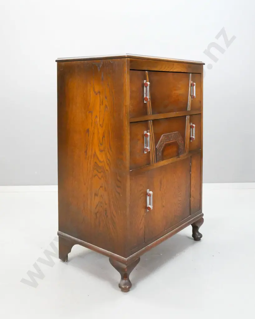 art deco oak cabinet with 2 drawers, single cupboard door with applied decoration, chrome and bakelite handles, on short Image 1++