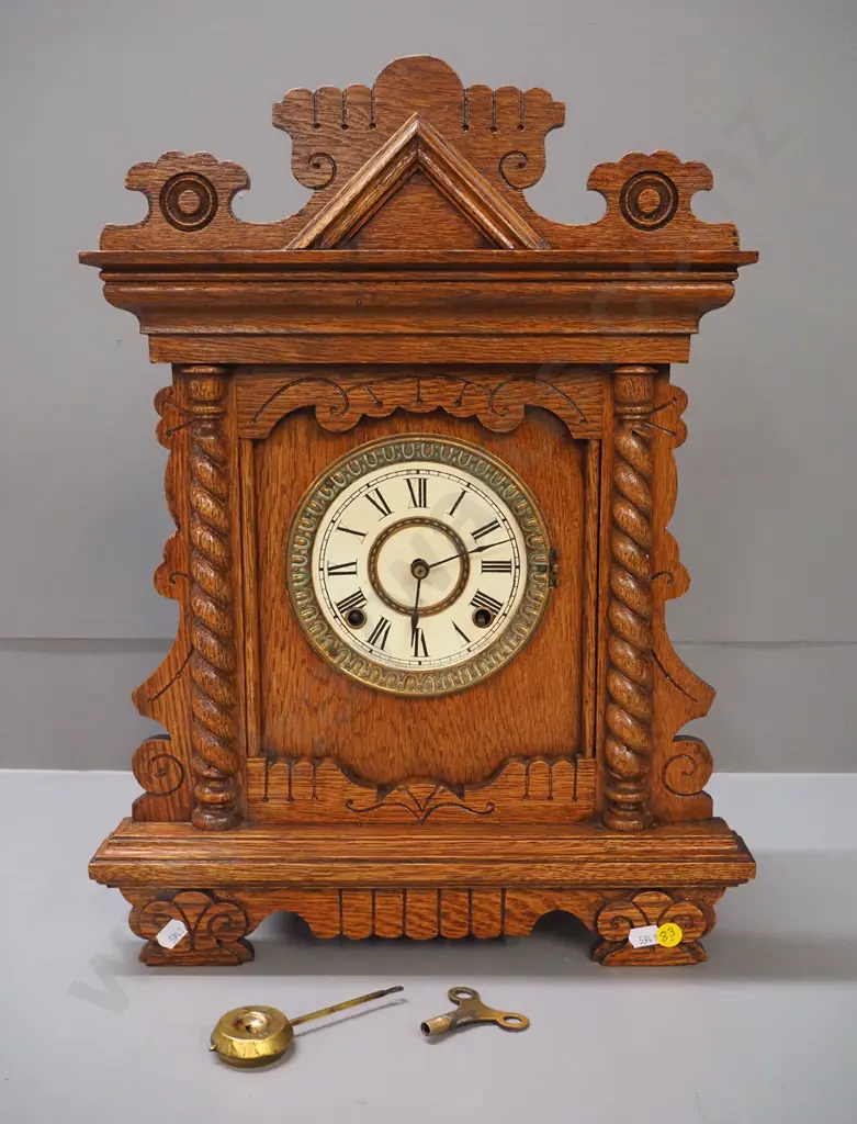 oak cased Ansonia mantel clock with pendulum and key - brass and printed card face, missing glass bezel H480 W360 D125 Image 1++