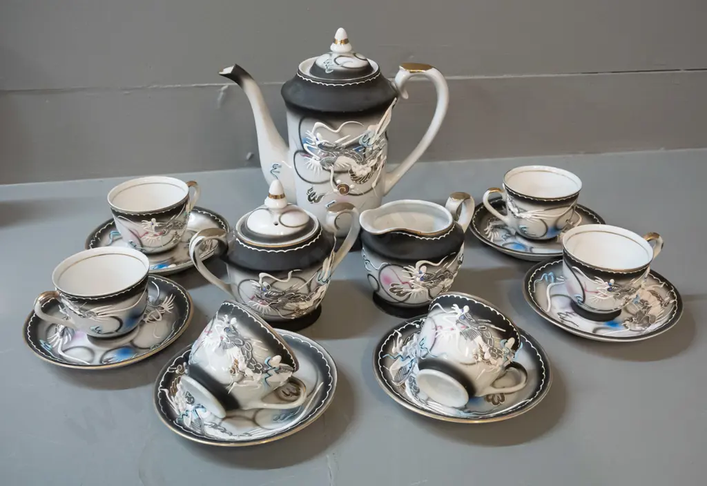Chinese tea / coffee set with raised dragon motif decoration - 6 cups & saucers, coffee/tea pot H195, cream & sugar Image 1++