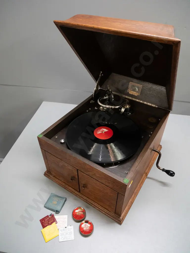 vintage HMV oak-cased wind-up gramophone with Bristol Piano Co. label, 2 tins and sample paper packets of needles, and a Image 1++