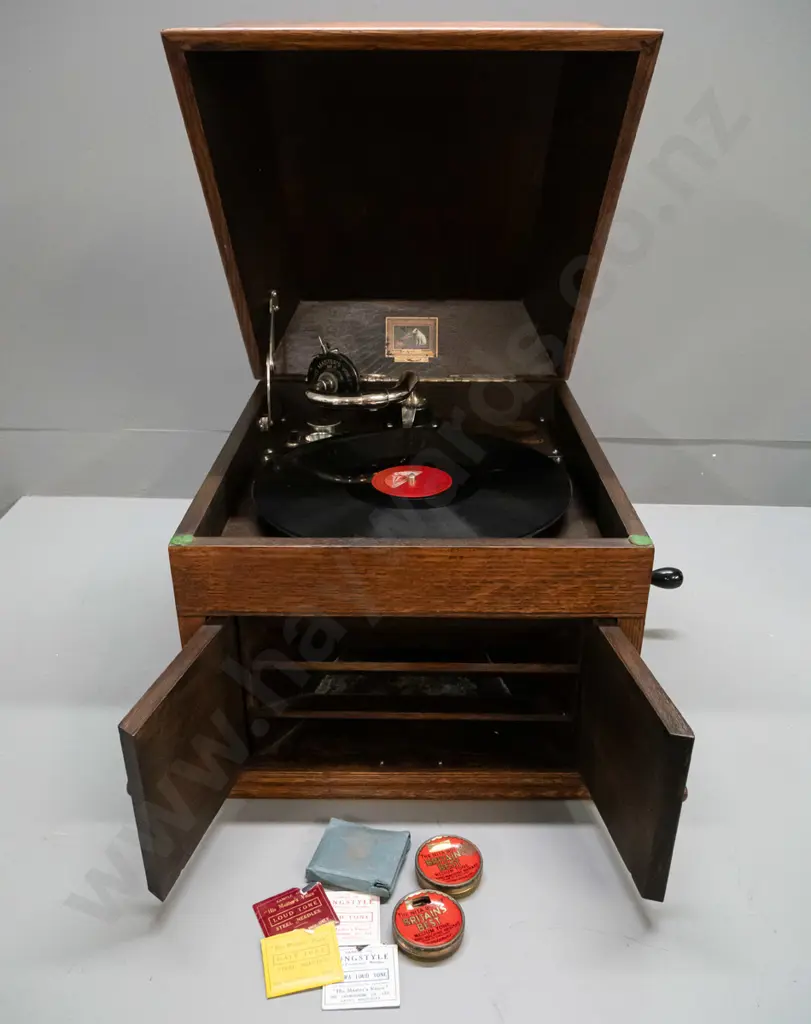 vintage HMV oak-cased wind-up gramophone with Bristol Piano Co. label, 2 tins and sample paper packets of needles, and a Image 1++