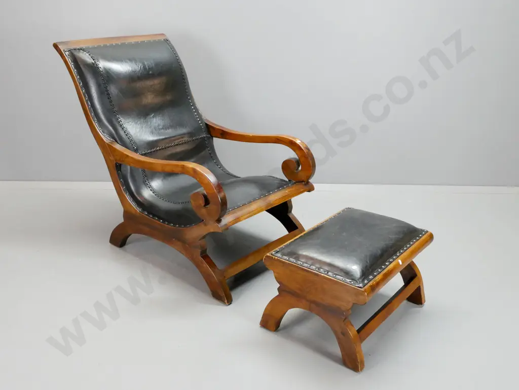 reproduction scrolled open-arm lounge chair with matching foot stool, laced and studded black leather upholstery - some Image 1++