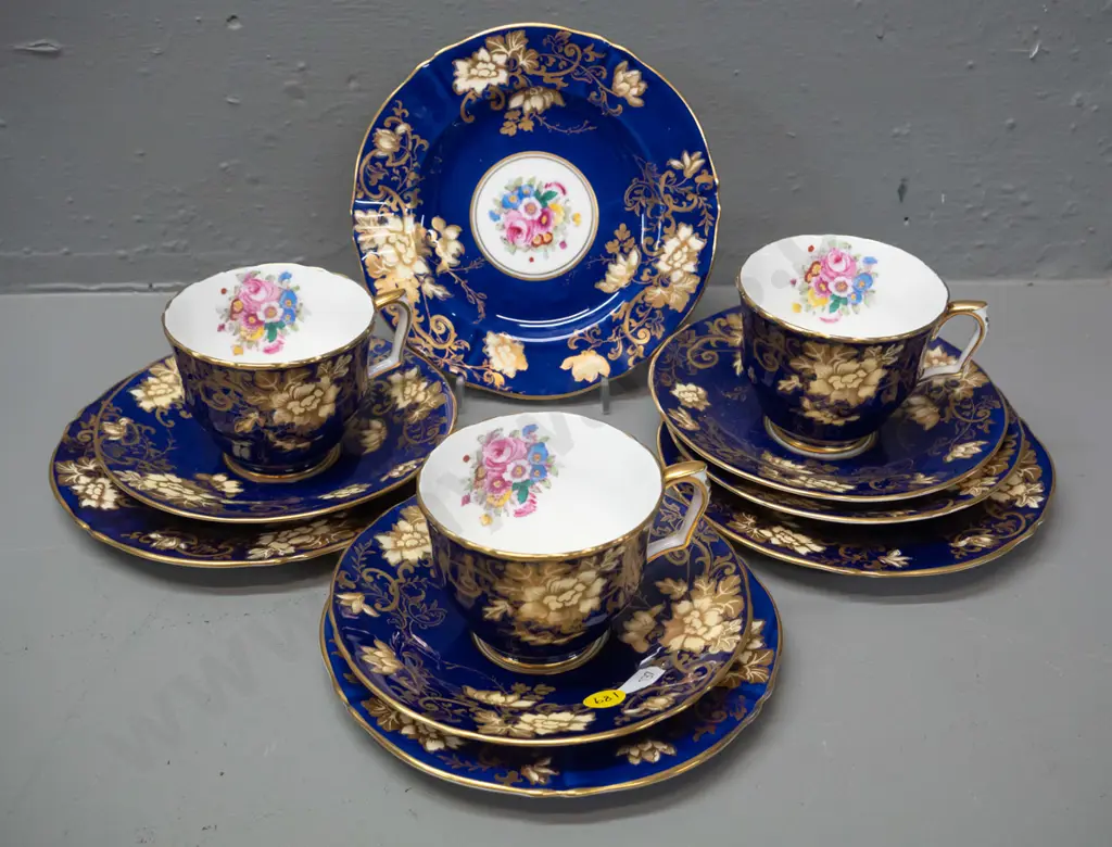 3 Crown Staffordshire hand painted cobalt and gilt trios with spare saucer and plate Image 1++