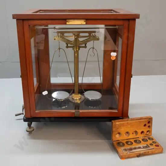 vintage Oertlin London precision balance scales in glazed mahogany case, black glass base, with weights in fitted timber