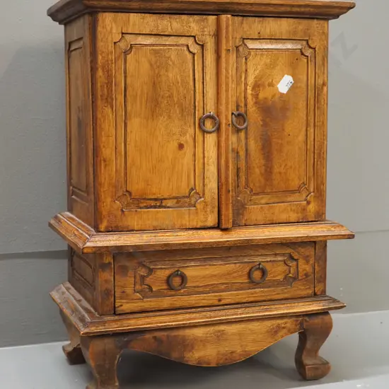 small asian hardwood cabinet with 2 doors, 3 internal and 1 exterior drawer - corrosion to metal ring handles, fading to