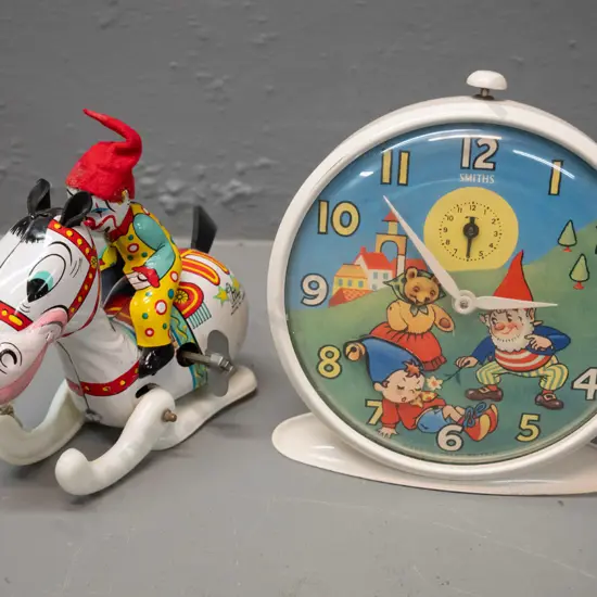retro Smiths children's Noddy character alarm clock and a small wind up Mikuni Japanese tin toy with plastic legs. Clock