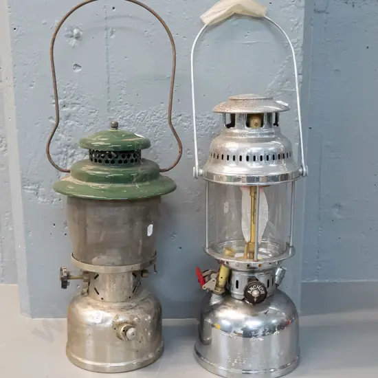 2 spirit camping lanterns - Coleman USA - some corrosion - and Anchor China - pitting to chrome. Anchor is H-400