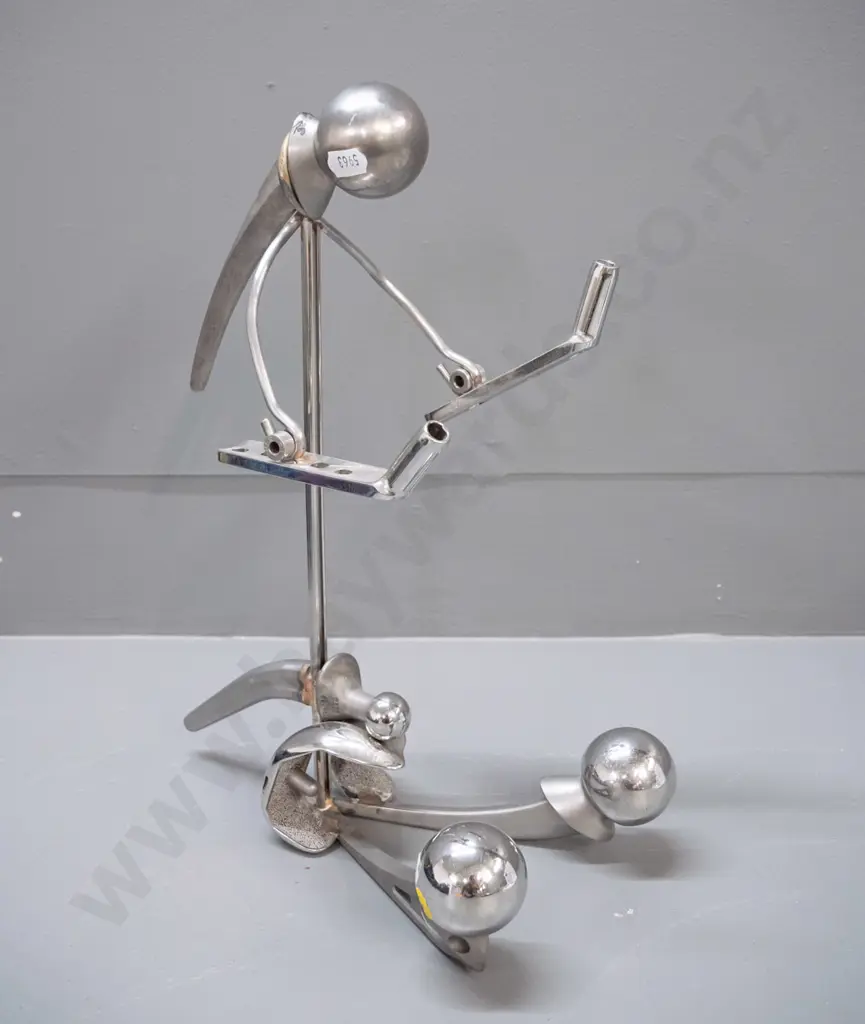 unusual figure made from chromed metal replacement hip joints H-350 Image 1++
