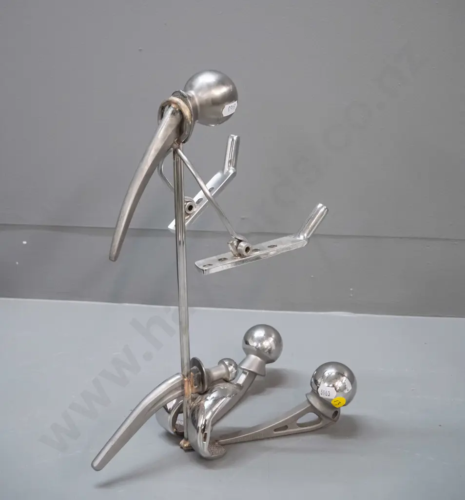 unusual figure made from chromed metal replacement hip joints H-350 Image 1++