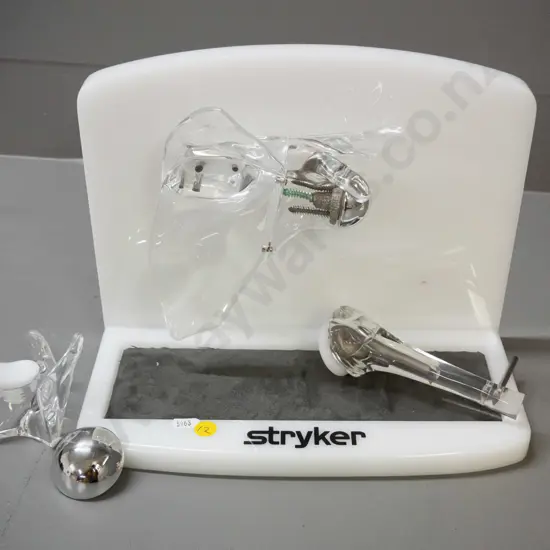 set of medical / anatomical joint models with display stand marked Stryker - plastic, perspex and metal, some with
