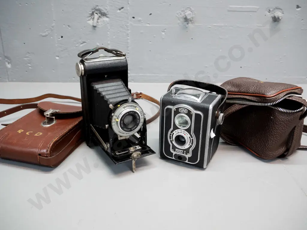 2 vintage film cameras with cases - Ising "Pucky 1" 120 box camera H-110 and a folding Kodak 620 Brownie Image 1++