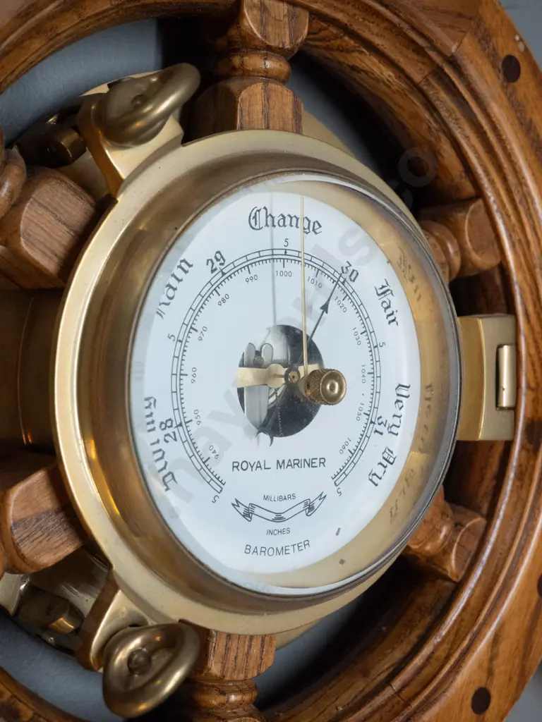 reproduction oak ship's wheel and cast brass porthole wall barometer. Marked Royal Mariner, Made in Taiwan sticker D-470 Image 1++