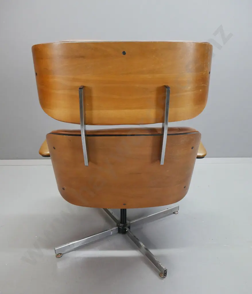 vintage Eames style leather upholstered swivel lounge chair with matching footstool, vinyl upholstered arms. Missing Image 1++