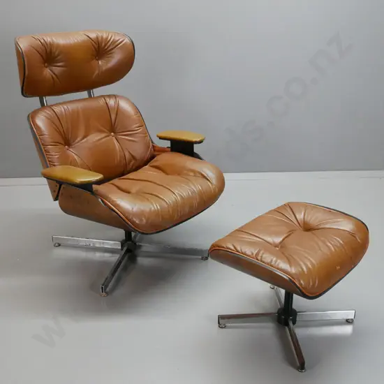 vintage Eames style leather upholstered swivel lounge chair with matching footstool, vinyl upholstered arms. Missing