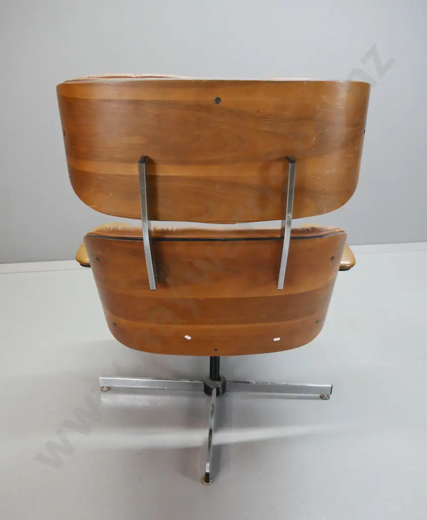 vintage Eames style leather upholstered swivel lounge chair with matching footstool, vinyl upholstered arms. Missing Image 1++