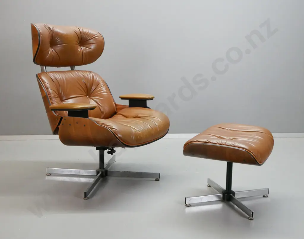vintage Eames style leather upholstered swivel lounge chair with matching footstool, vinyl upholstered arms. Missing Image 1++