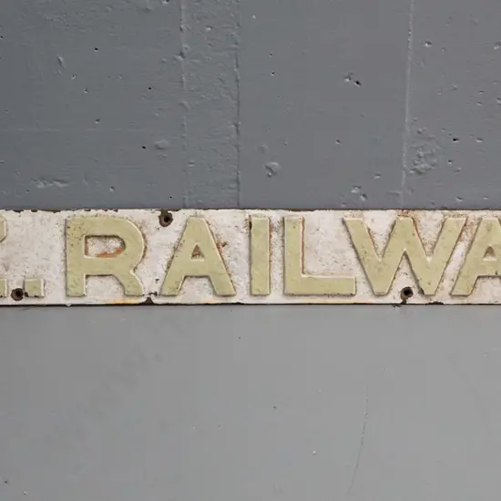 painted cast metal raised lettering N.Z. Railways with screw holes for mounting. Corrosion and paint chipping H100 W1000