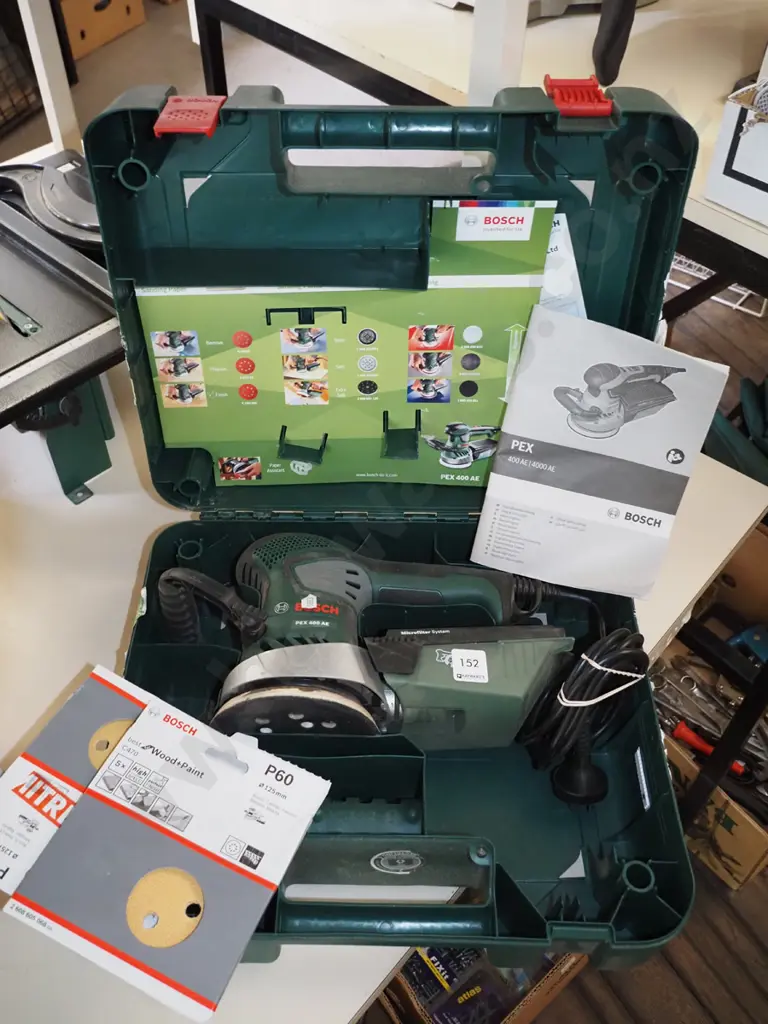 cased Bosch orbital sander with additional discs Image 1++