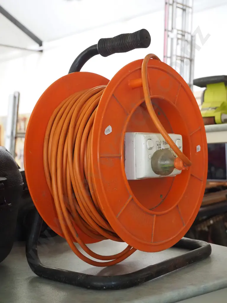 orange extension cord and reel Image 1++