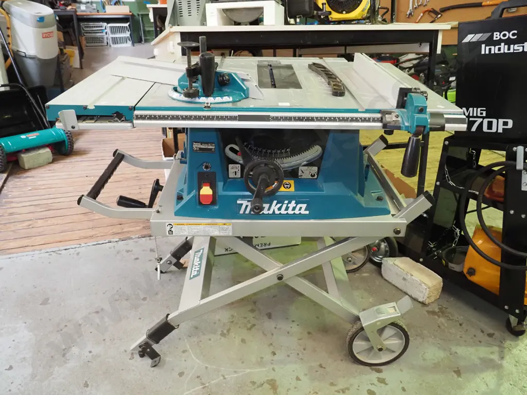 Makita MLT100 1500W table saw on folding wheeled stand Image 1++