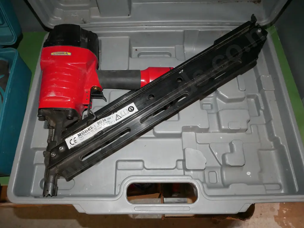 cased Cobra air powered nail gun Image 1++