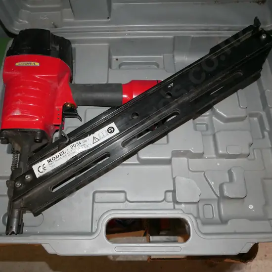 cased Cobra air powered nail gun