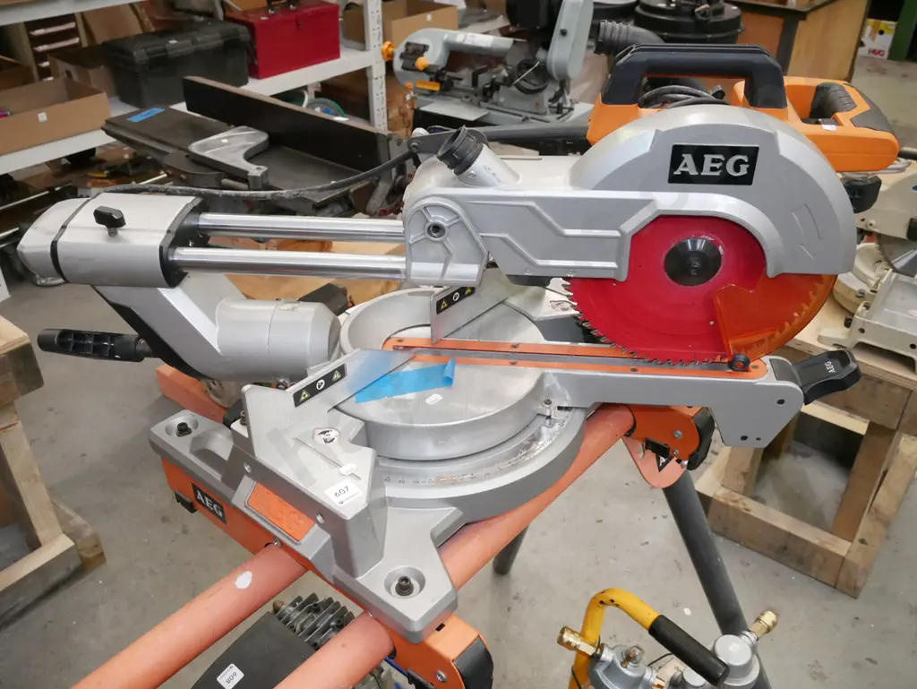 AEG sliding drop saw with matching foldaway stand Image 1++