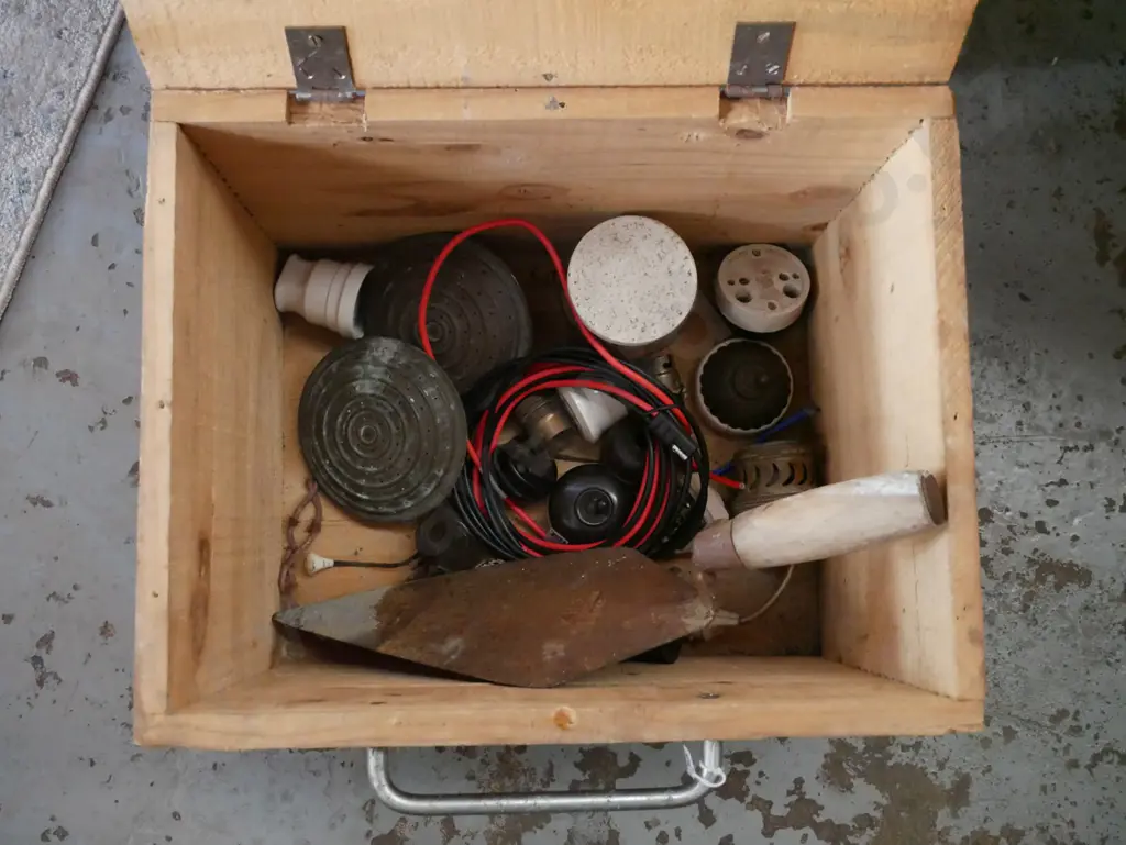 homemade wooden box - some borer - with watering can roses, light switches, trowel, etc. Image 1++