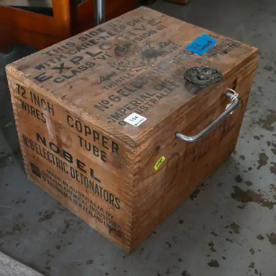 homemade wooden box - some borer - with watering can roses, light switches, trowel, etc.