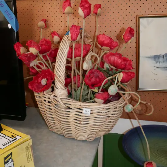 cane basket and fake poppies