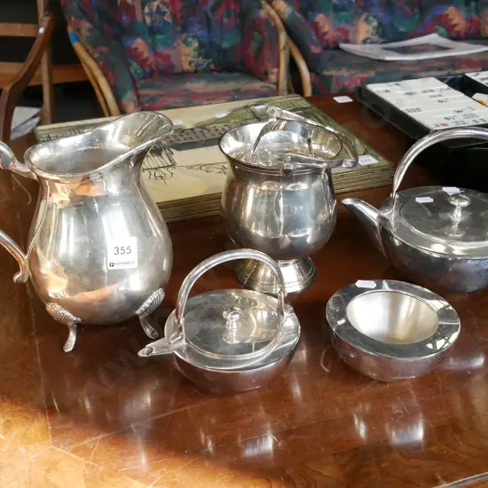 plated tea pots, water jug, sugar