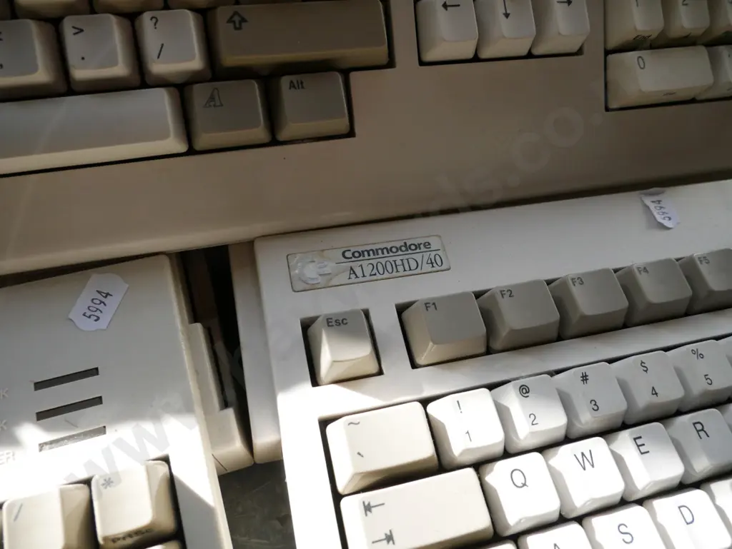 3x Commodore Amiga keyboard/computers and box of power supplies and other accessories Image 1++