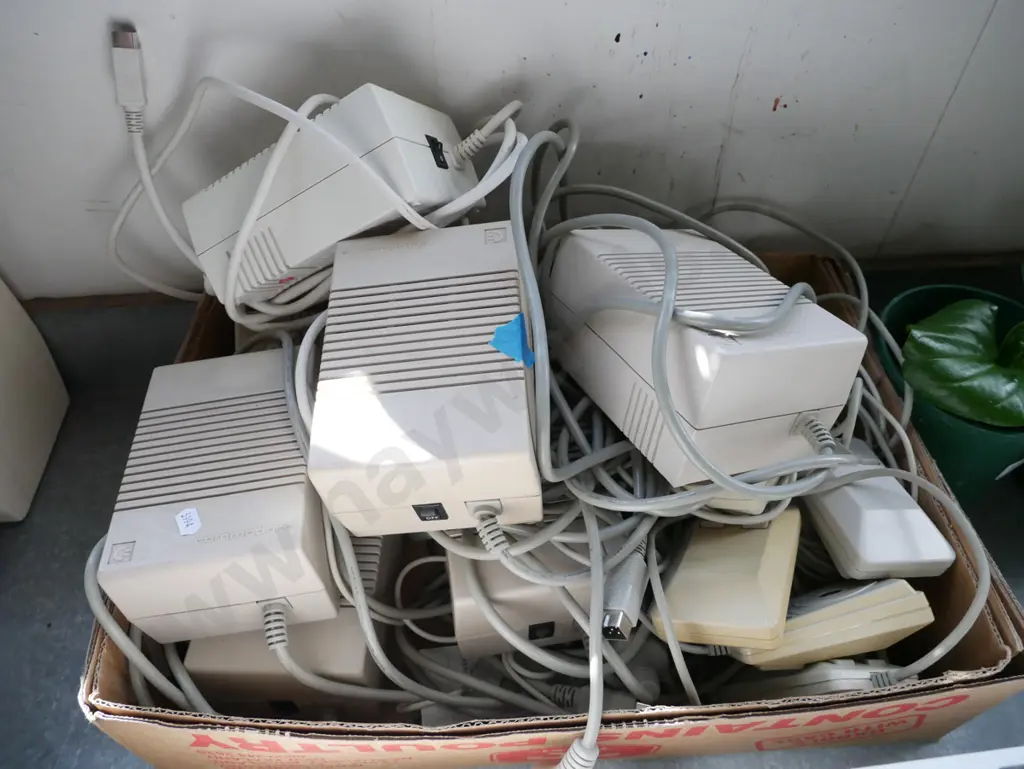 3x Commodore Amiga keyboard/computers and box of power supplies and other accessories Image 1++