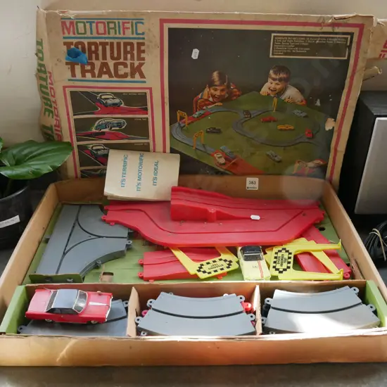 early toy car and race track set