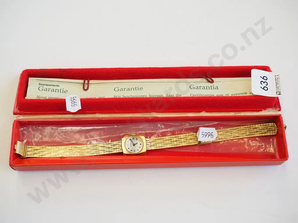 golden wristwatch in case Image 1++