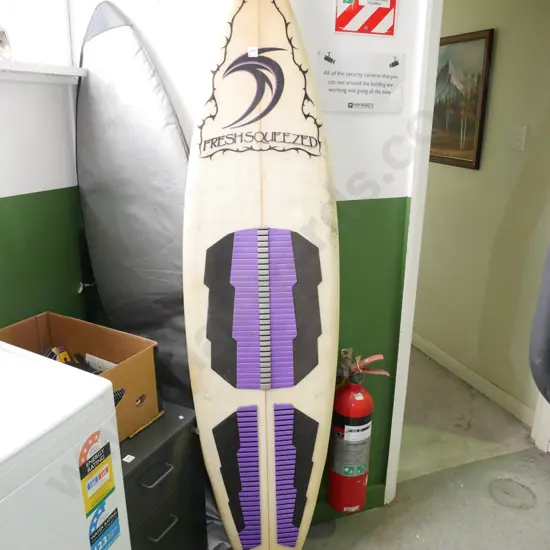 Freshly Squeezed brand surfboard in bag - see photos for details and specs.