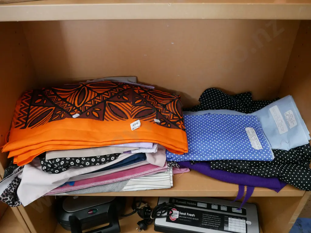 shelf of fabric pieces Image 1++