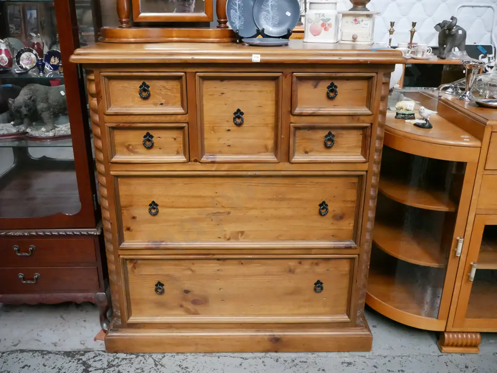 solid pine 7 drawer tall boy with cast metal drop handles H-1210 W-1100 D-500 Image 1++