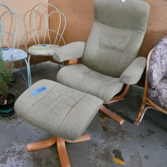 Norwegian green upholstered swivel armchair with matching footstool