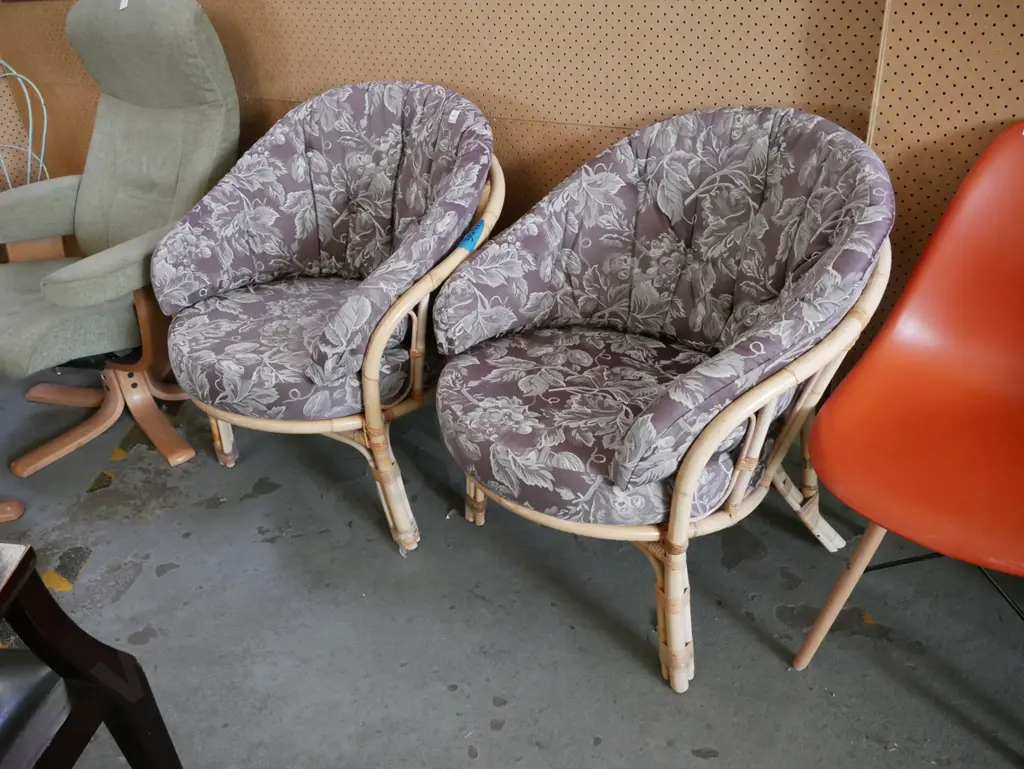 2x bamboo and cane chairs with floral upholstery cushions Image 1++