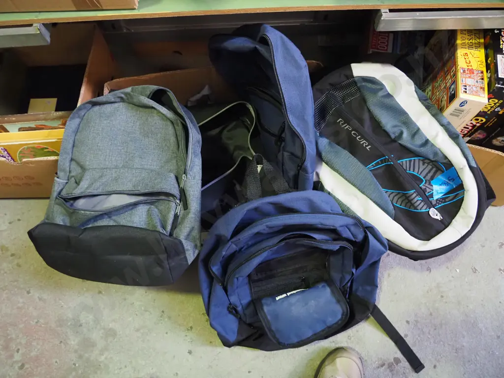 box of various backpacks Image 1++